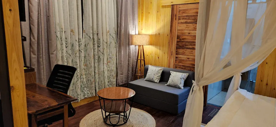 The Machan's lounge corner with a writing desk